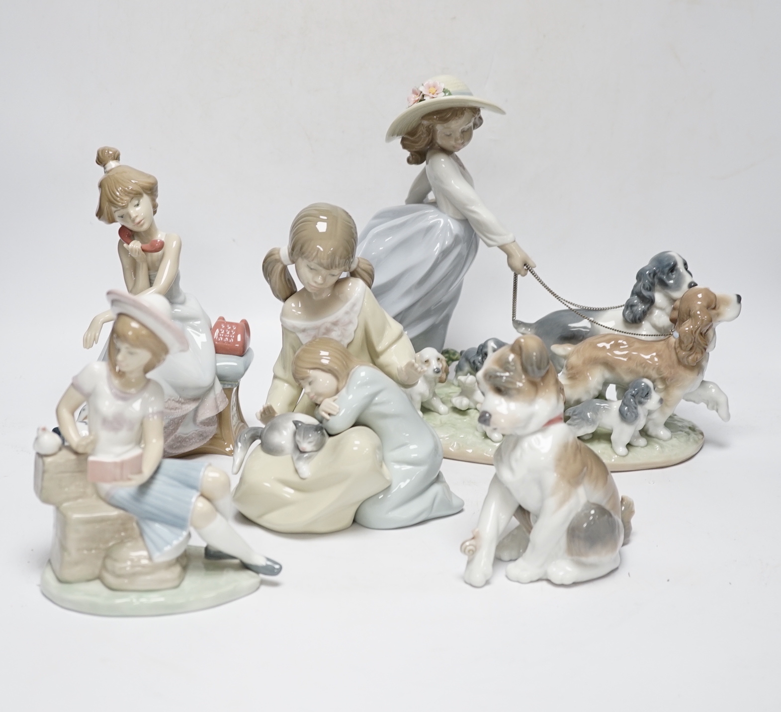 A large Lladro figure group “La gran familia, Puppy Brigade”, Baby Jesus, Duckling, New Friend, Chit-Chat, Sunday’s Child, Little Sister, Cat and Mouse and heavenly Tenor (9), largest 30 cm wide